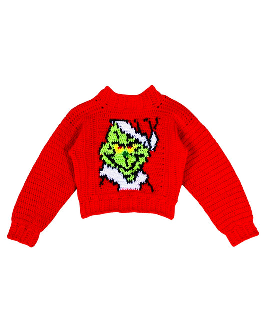 O suéter de crochê de Natal